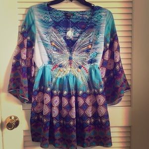 Top with jeweled butterfly